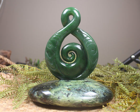 Kawakawa Pounamu Koru Twist set on a Pounamu base - NZ Greenstone