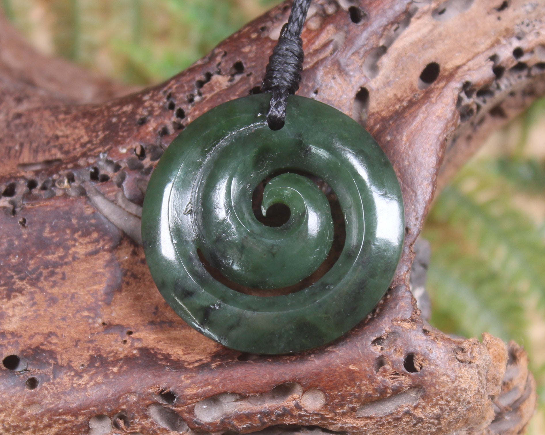 Koru carved from Rimu Pounamu - NZ Greenstone