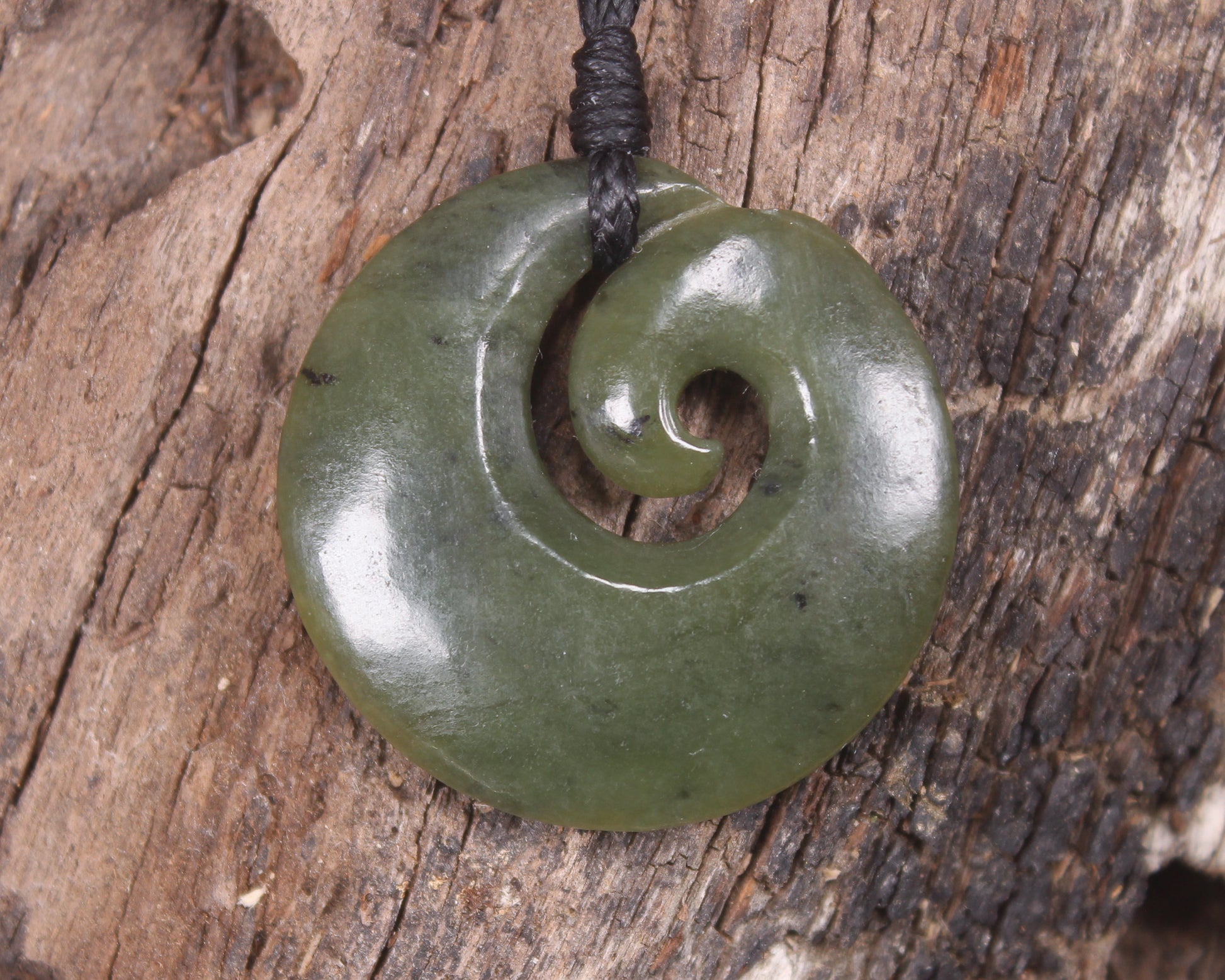 Koru carved from Rimu Pounamu - NZ Greenstone