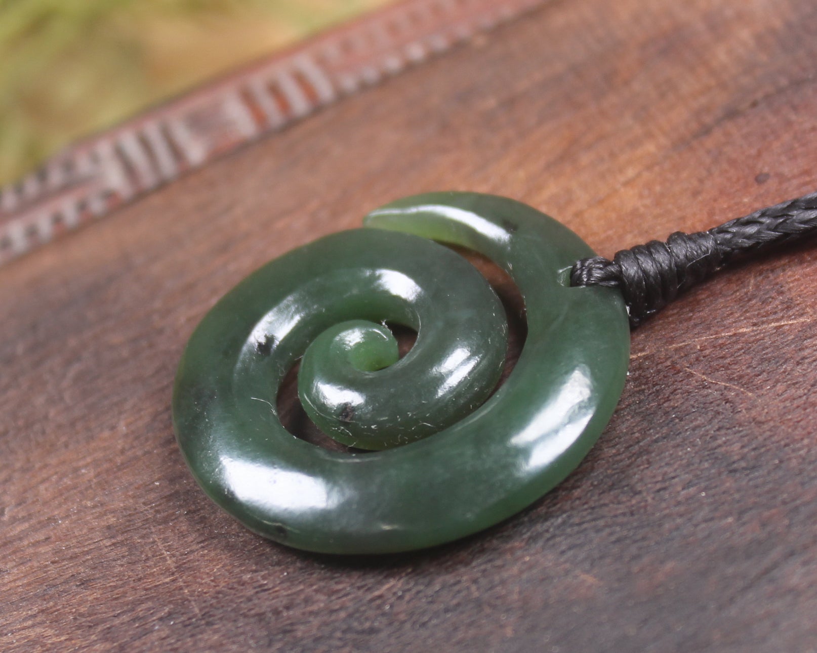 Koru pendant carved from Kawakawa Pounamu - NZ Greenstone