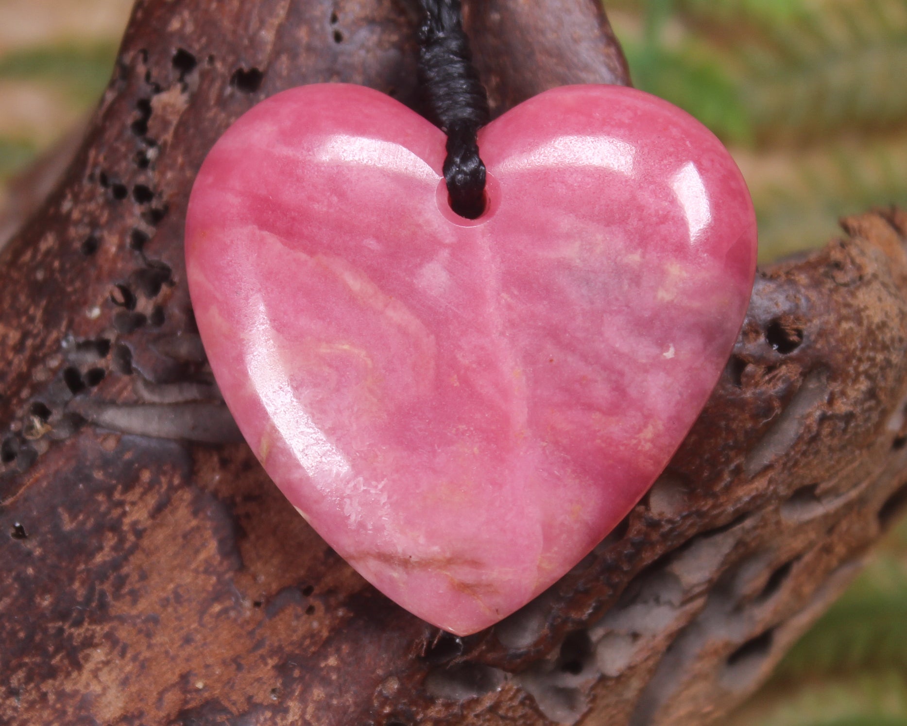 Heart carved from Rhodonite 