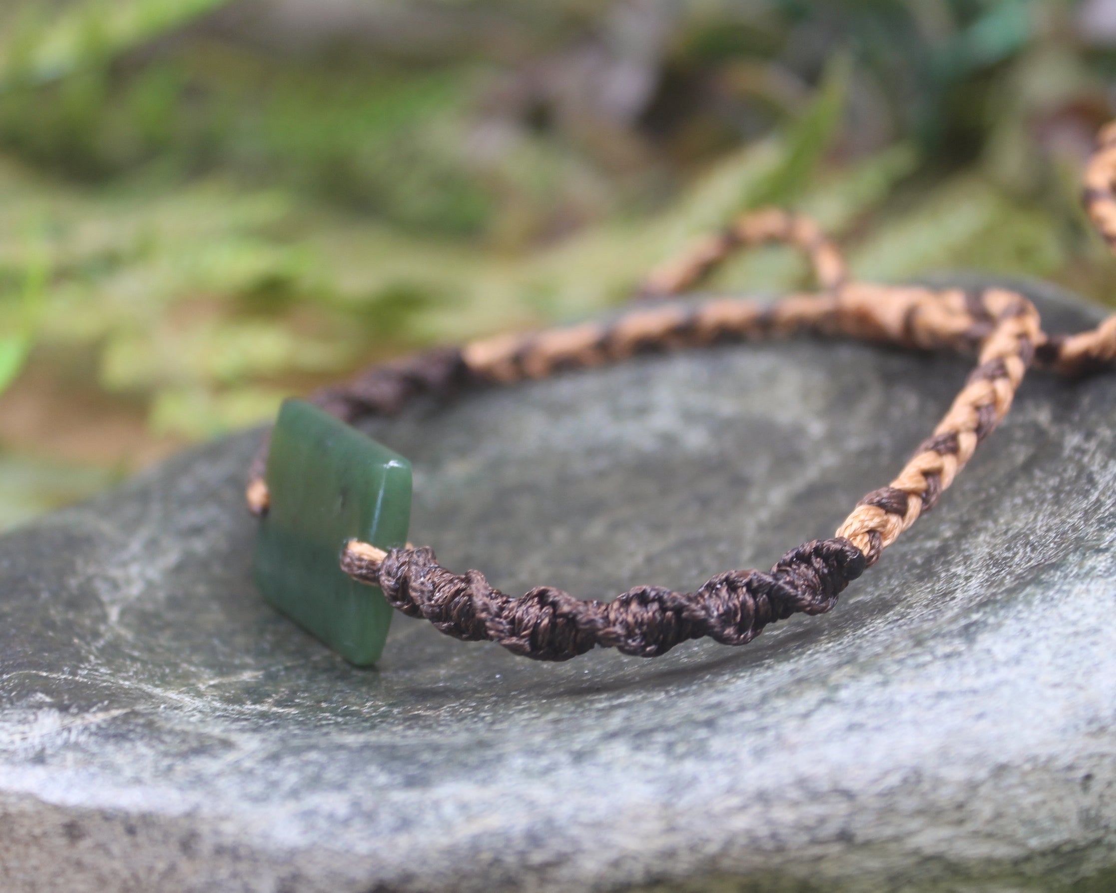 Adjustable cord bracelet with Hapopo Pounamu