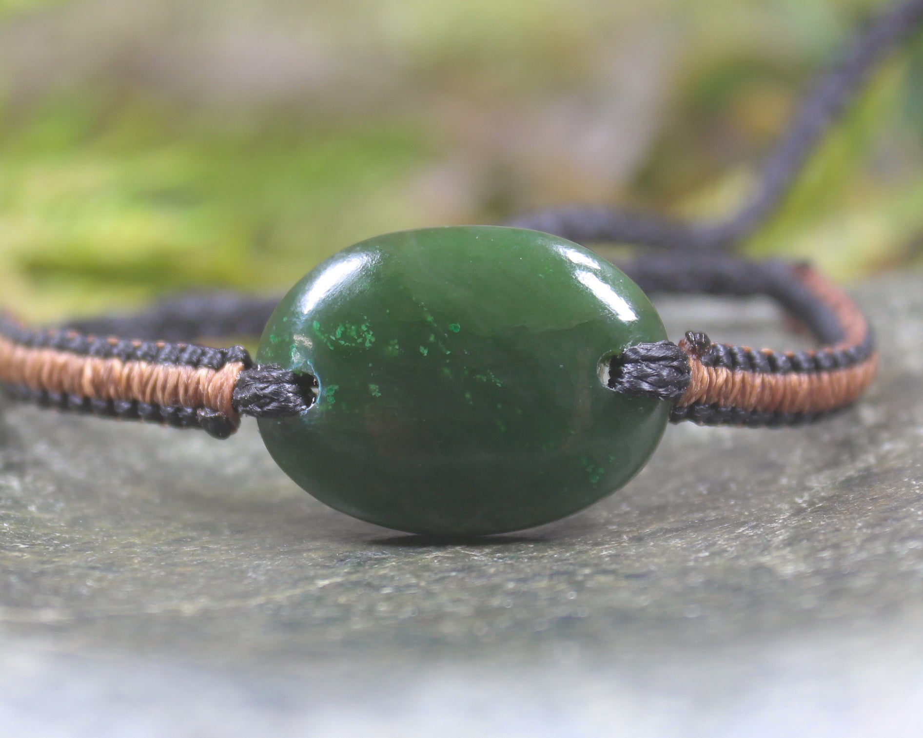 Adjustable cord bracelet with Kawakawa Pounamu