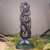Manaia sculpture carved from recycled wood