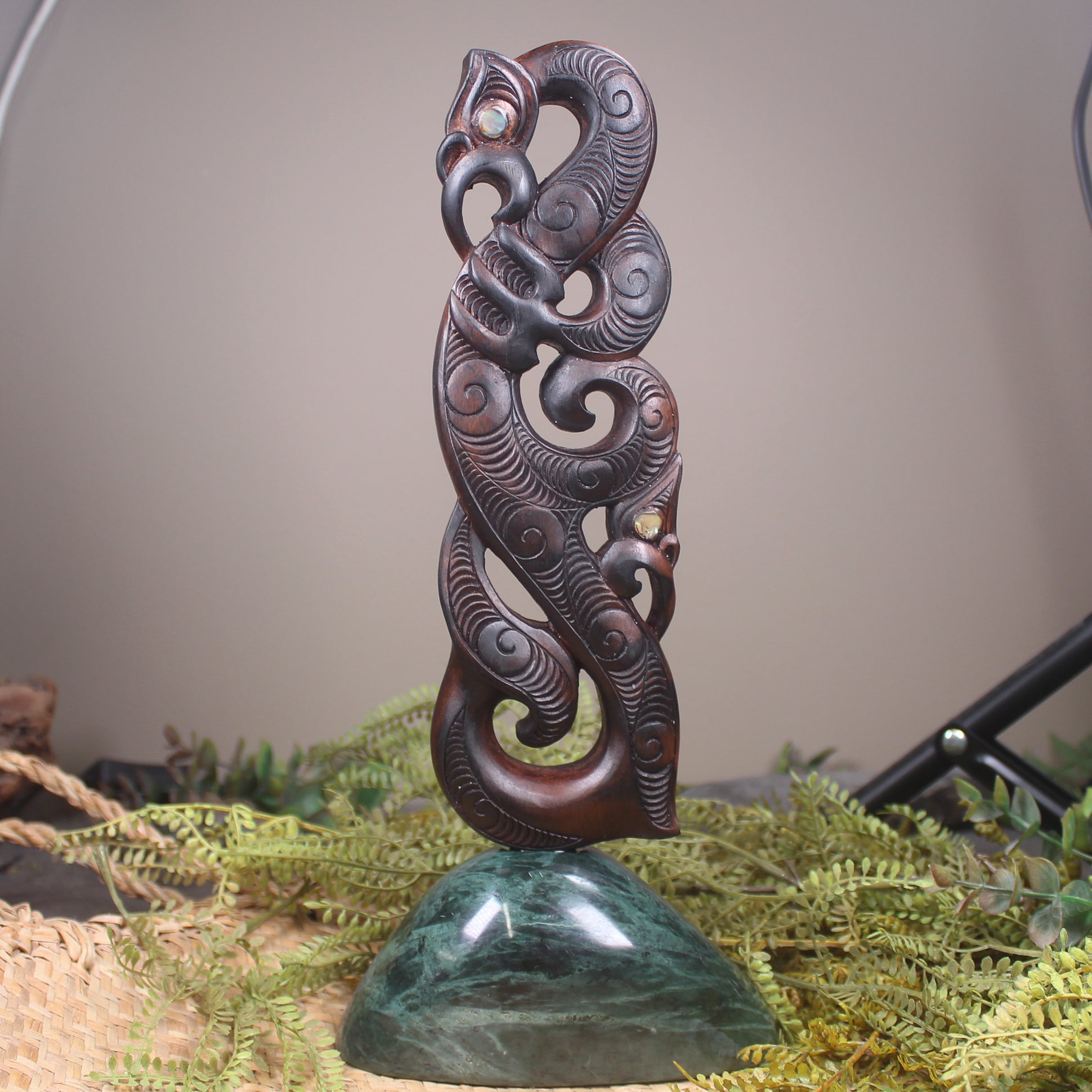Manaia sculpture carved from recycled wood