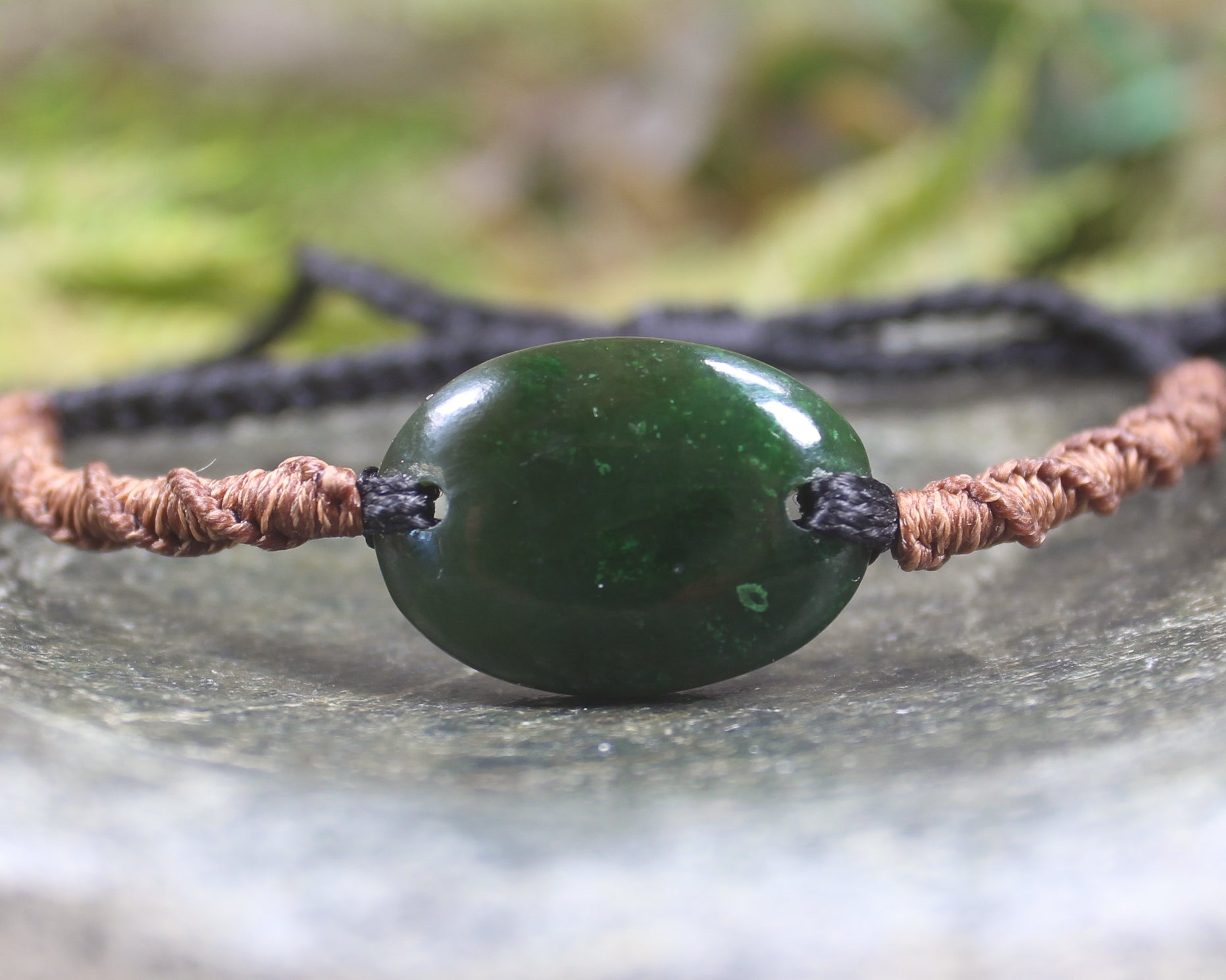 Adjustable cord bracelet with Kawakawa Pounamu