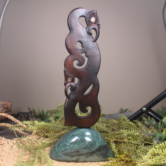 Manaia sculpture carved from recycled wood