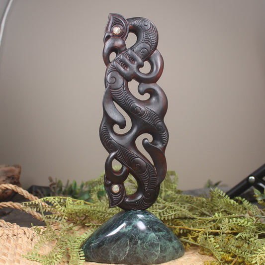 Manaia sculpture carved from recycled wood