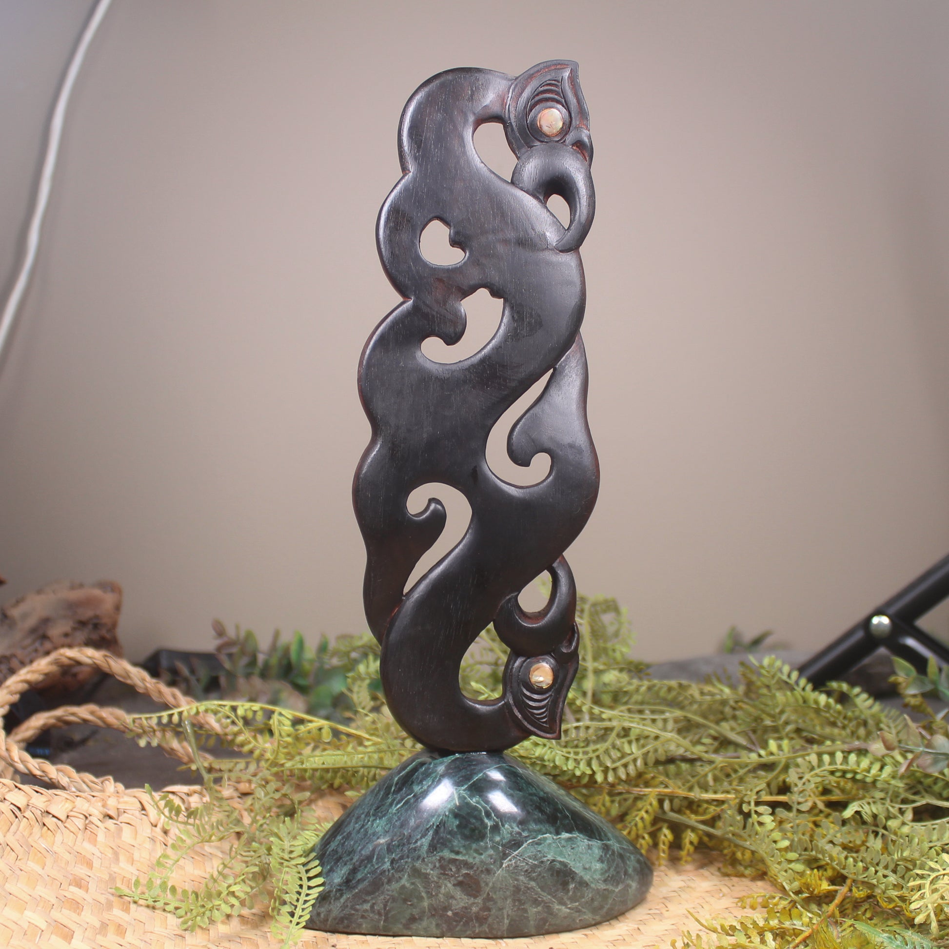 Manaia sculpture carved from recycled wood