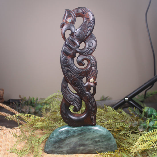 Manaia sculpture carved from recycled wood