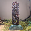 Manaia sculpture carved from recycled wood