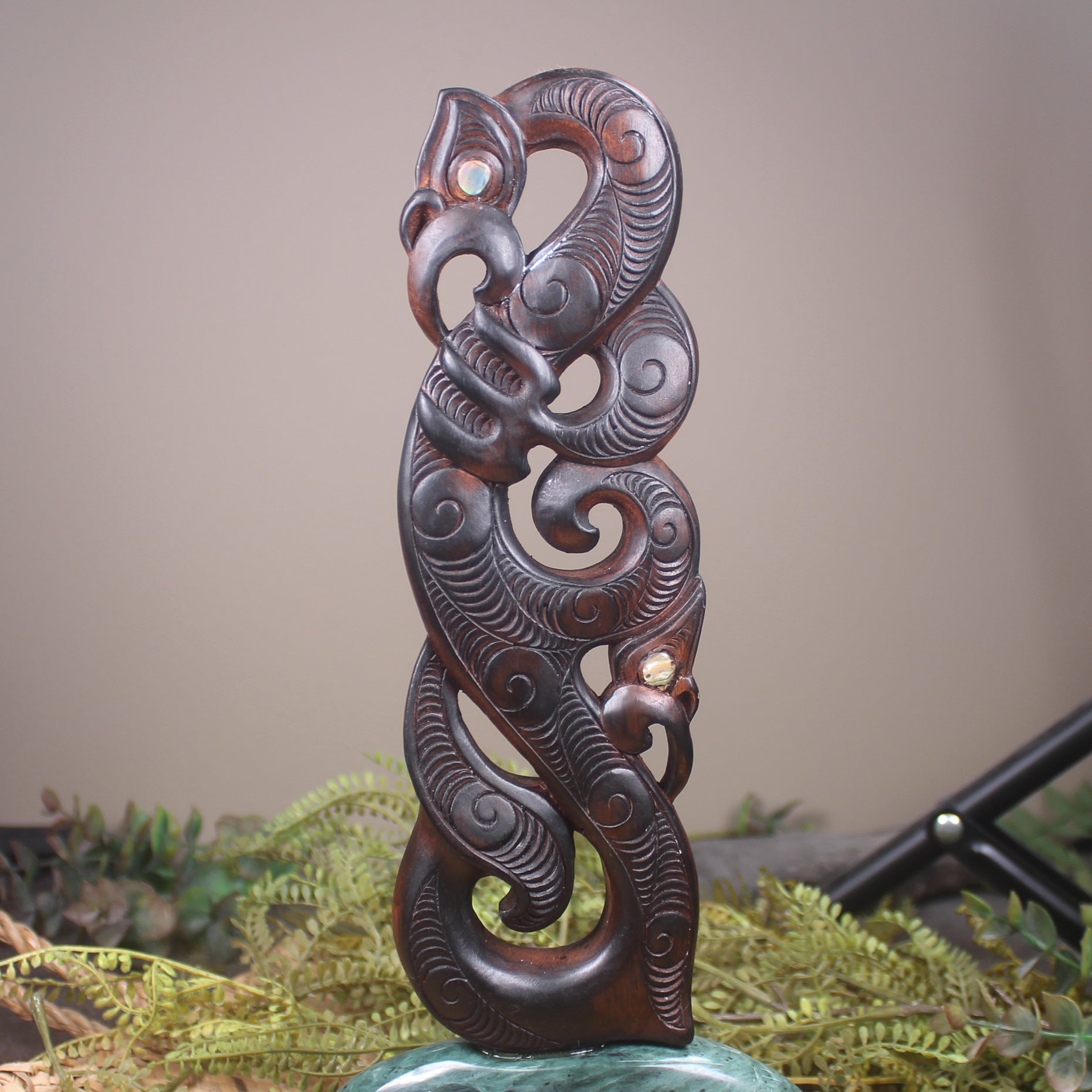 Manaia sculpture carved from recycled wood