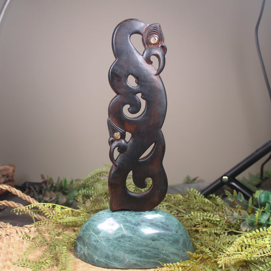 Manaia sculpture carved from recycled wood
