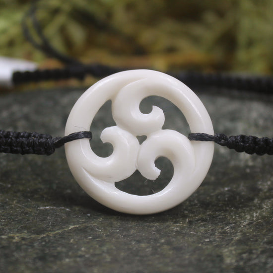Adjustable cord bracelet with bone pendant