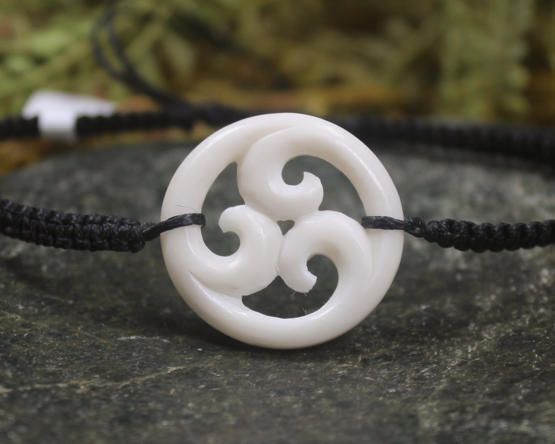 Adjustable cord bracelet with bone pendant