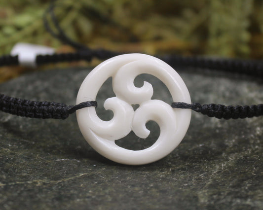 Adjustable cord bracelet with bone pendant