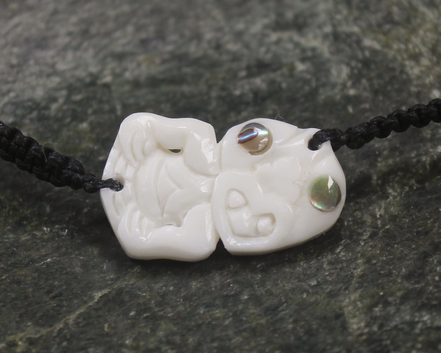 Adjustable cord bracelet with bone pendant