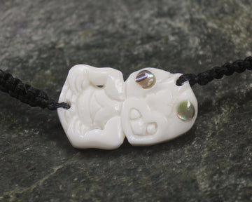 Adjustable cord bracelet with bone pendant