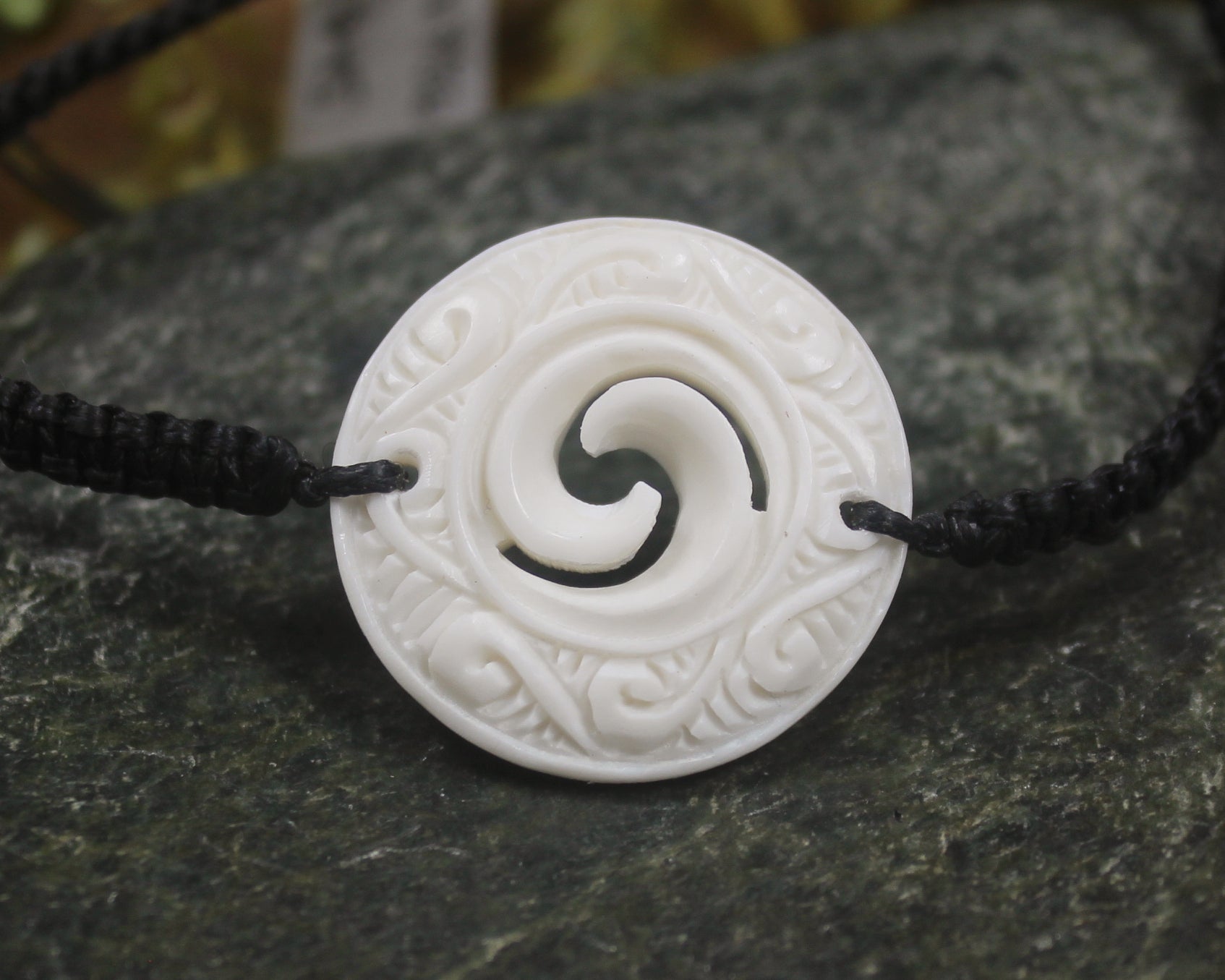 Adjustable cord bracelet with bone pendant