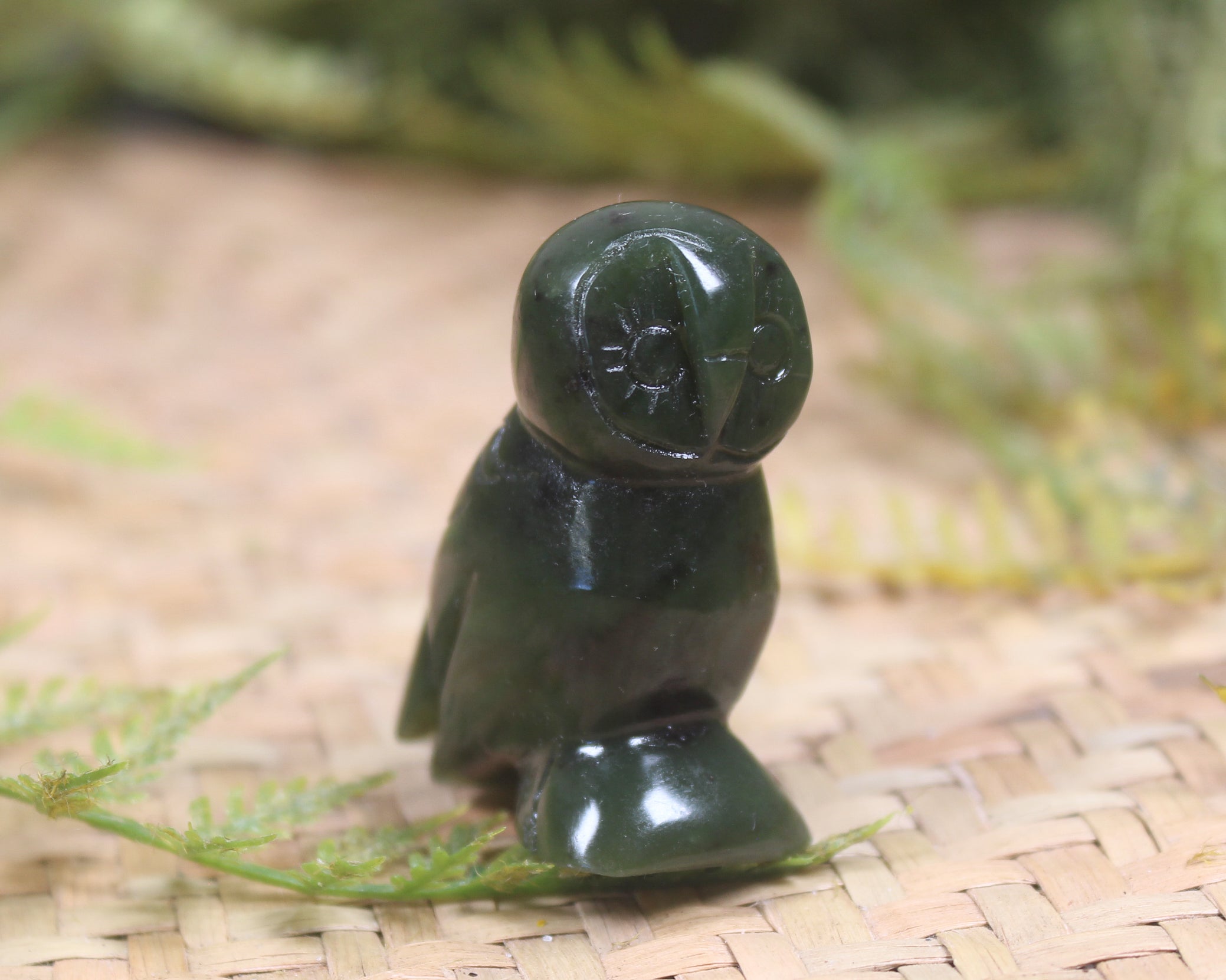 Pounamu owl sculpture