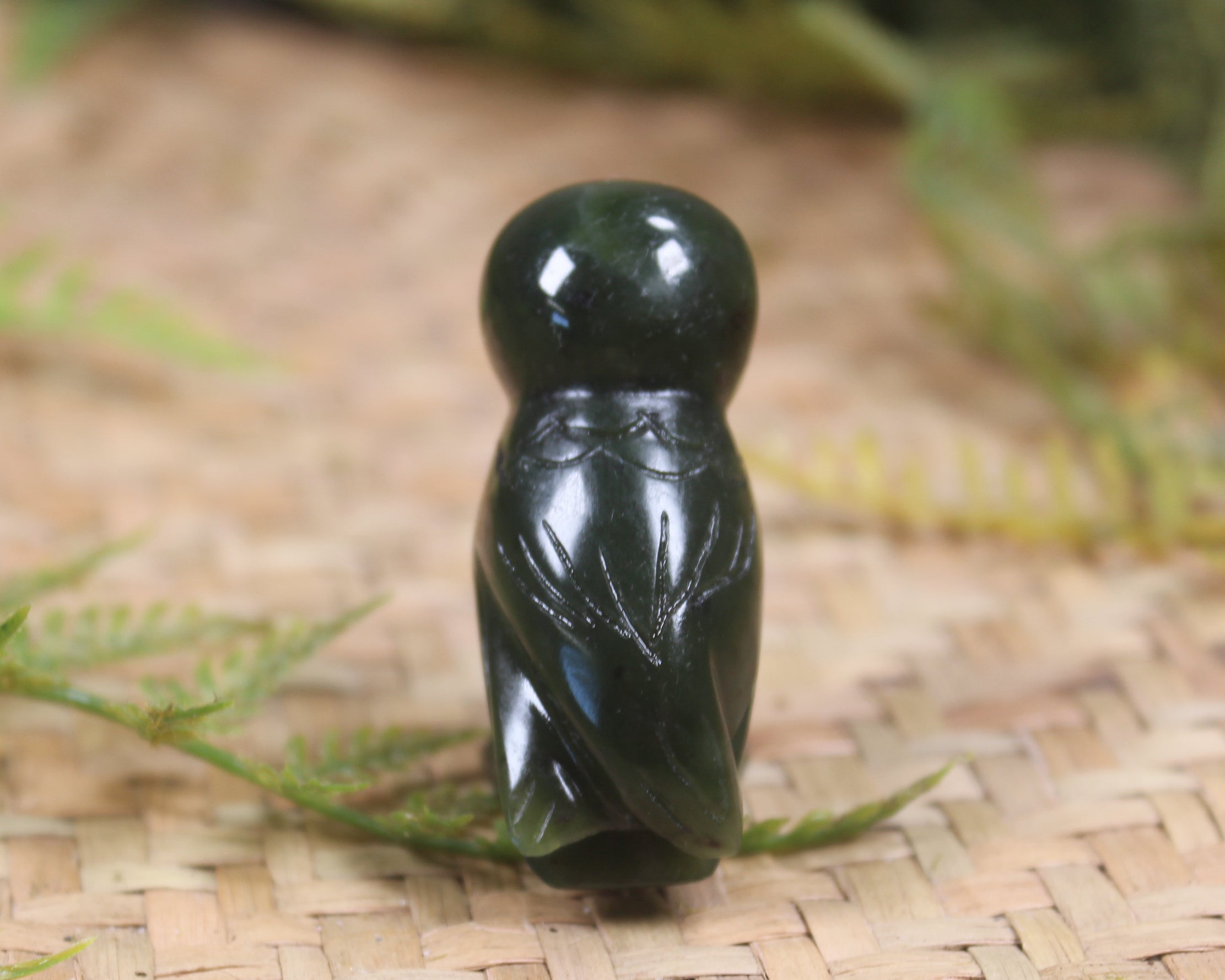 Pounamu owl sculpture