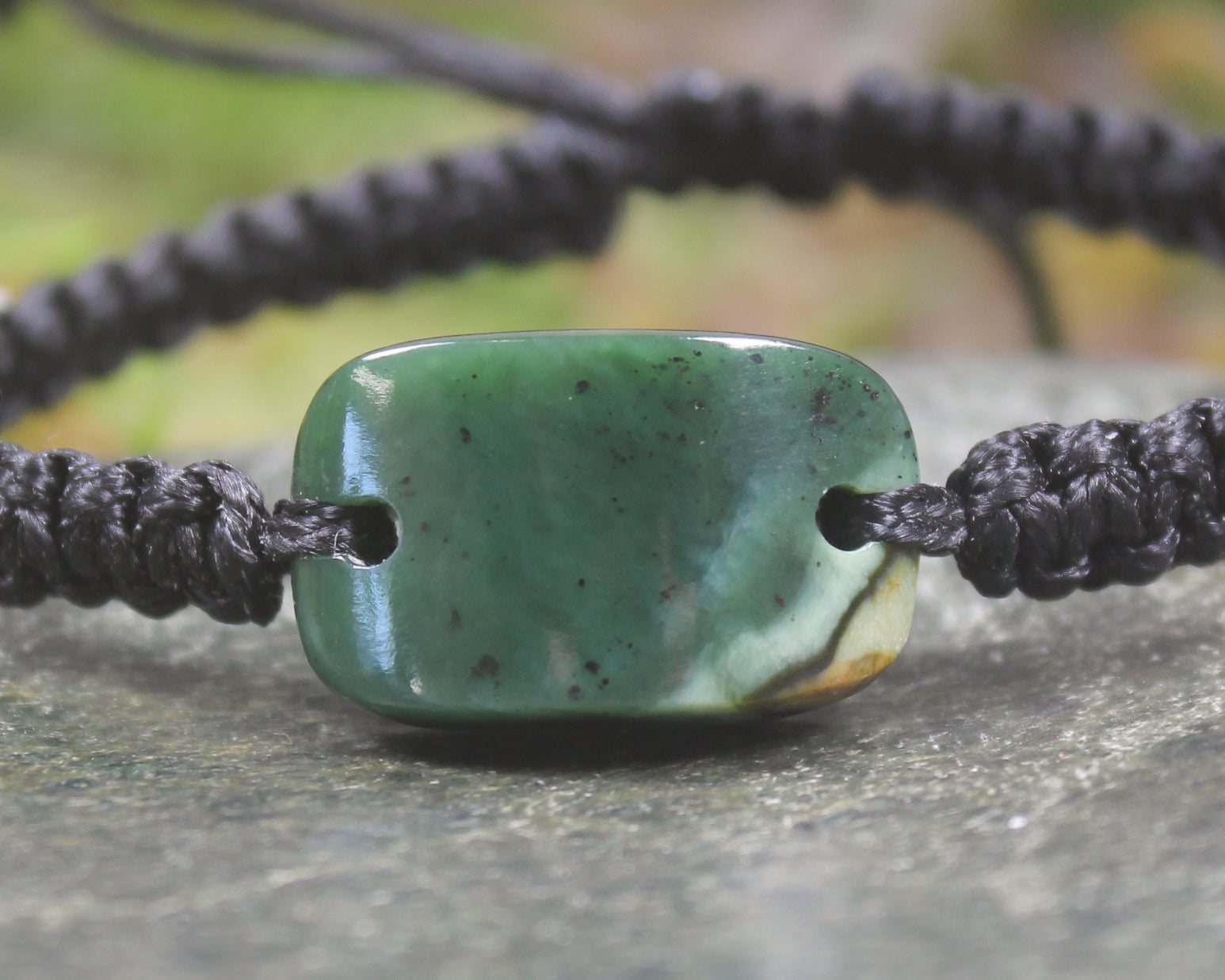 Adjustable cord bracelet with Kawakawa Pounamu