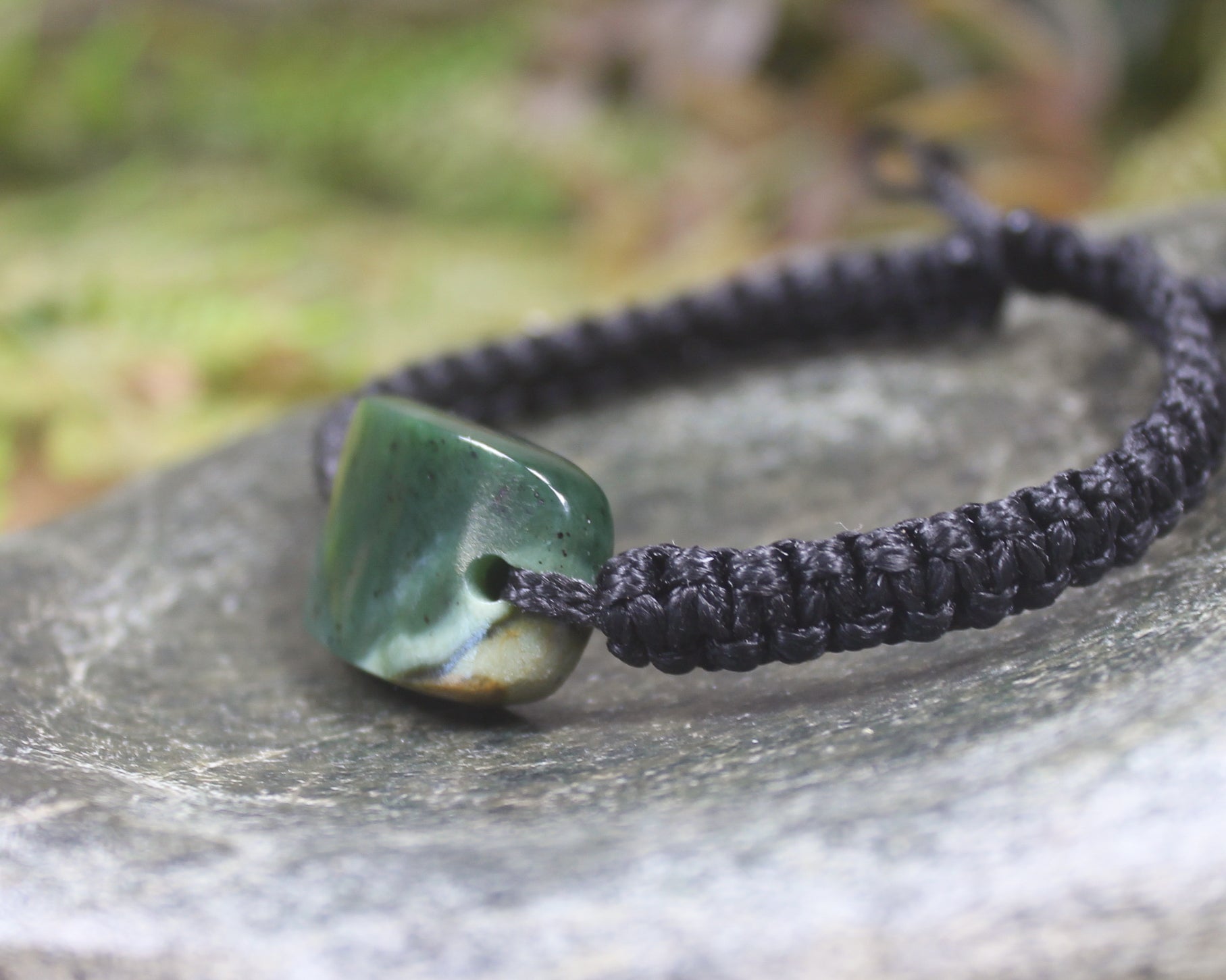 Adjustable cord bracelet with Kawakawa Pounamu