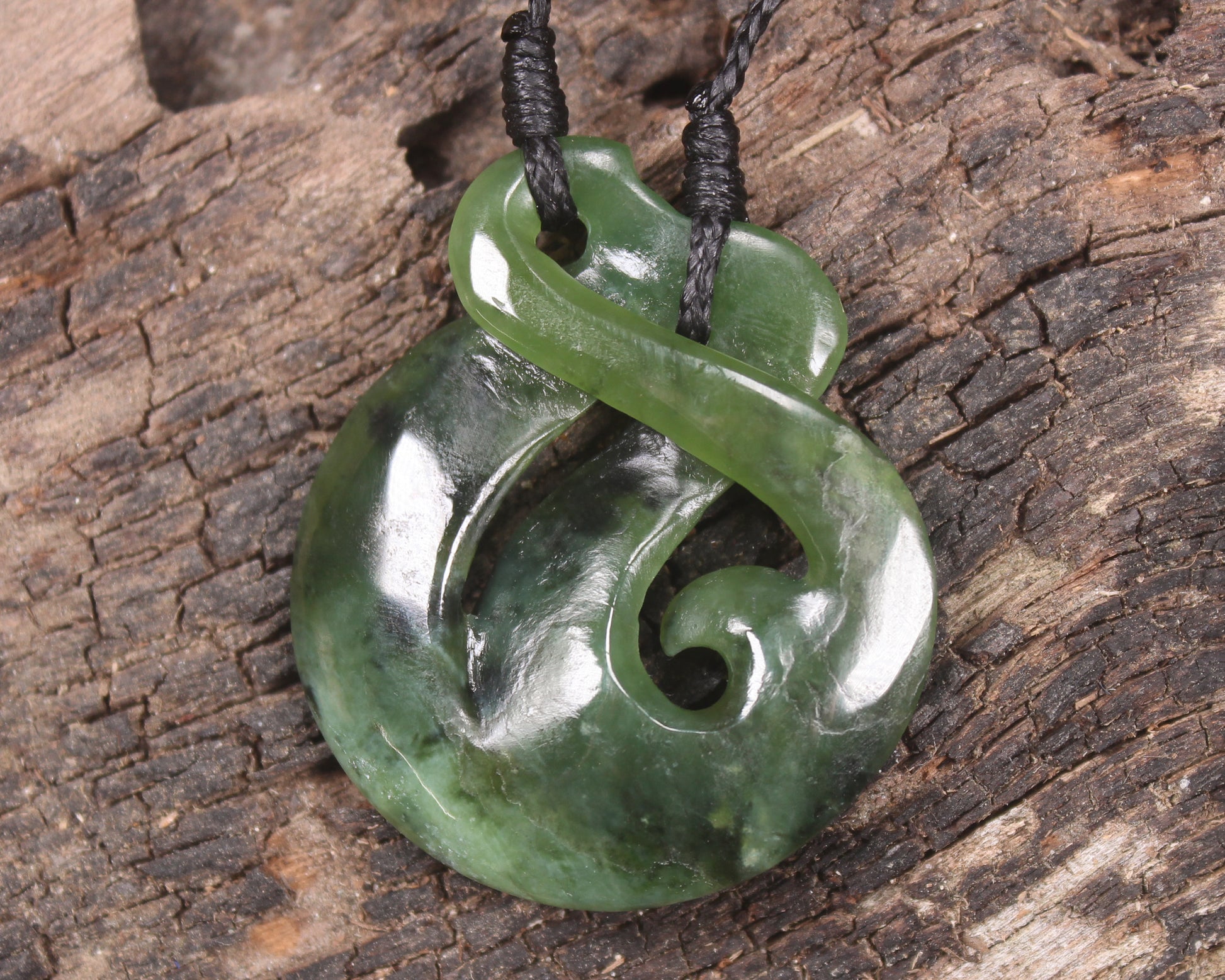Koru Twist Pendant carved from Rimu Pounamu - NZ Greenstone
