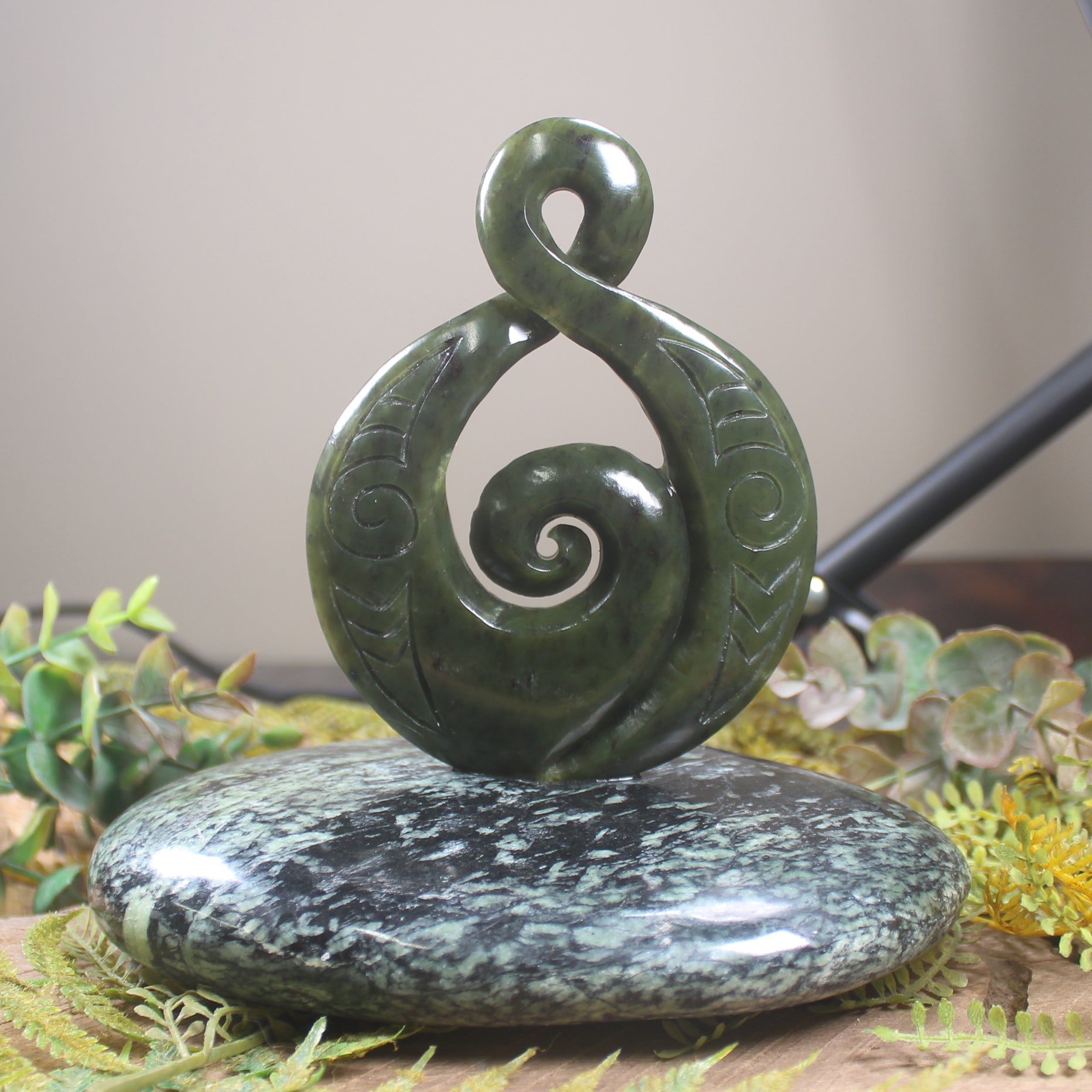 Rimu Pounamu Koru Twist set on a Pounamu base - NZ Greenstone