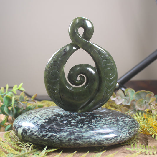 Rimu Pounamu Koru Twist set on a Pounamu base - NZ Greenstone