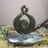 Rimu Pounamu Koru Twist set on a Pounamu base - NZ Greenstone