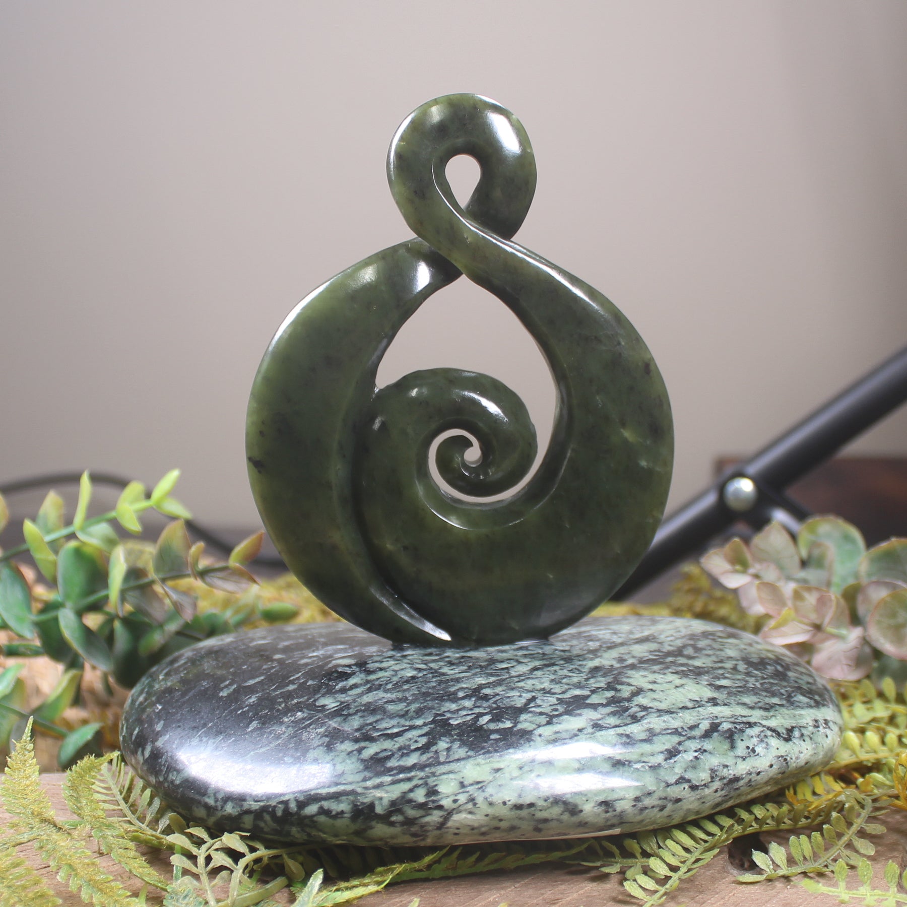 Rimu Pounamu Koru Twist set on a Pounamu base - NZ Greenstone