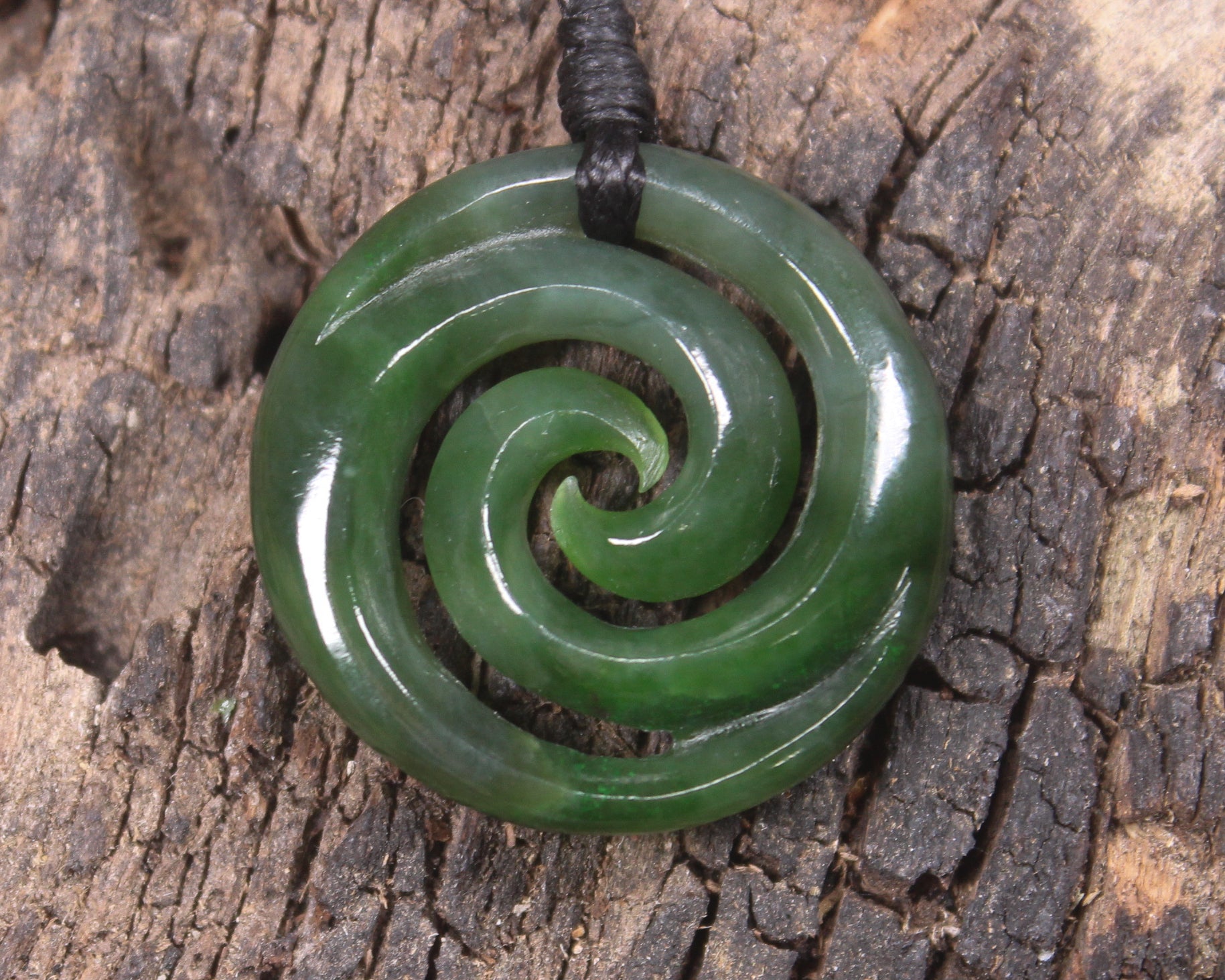 Koru pendant carved from Kawakawa Pounamu - NZ Greenstone