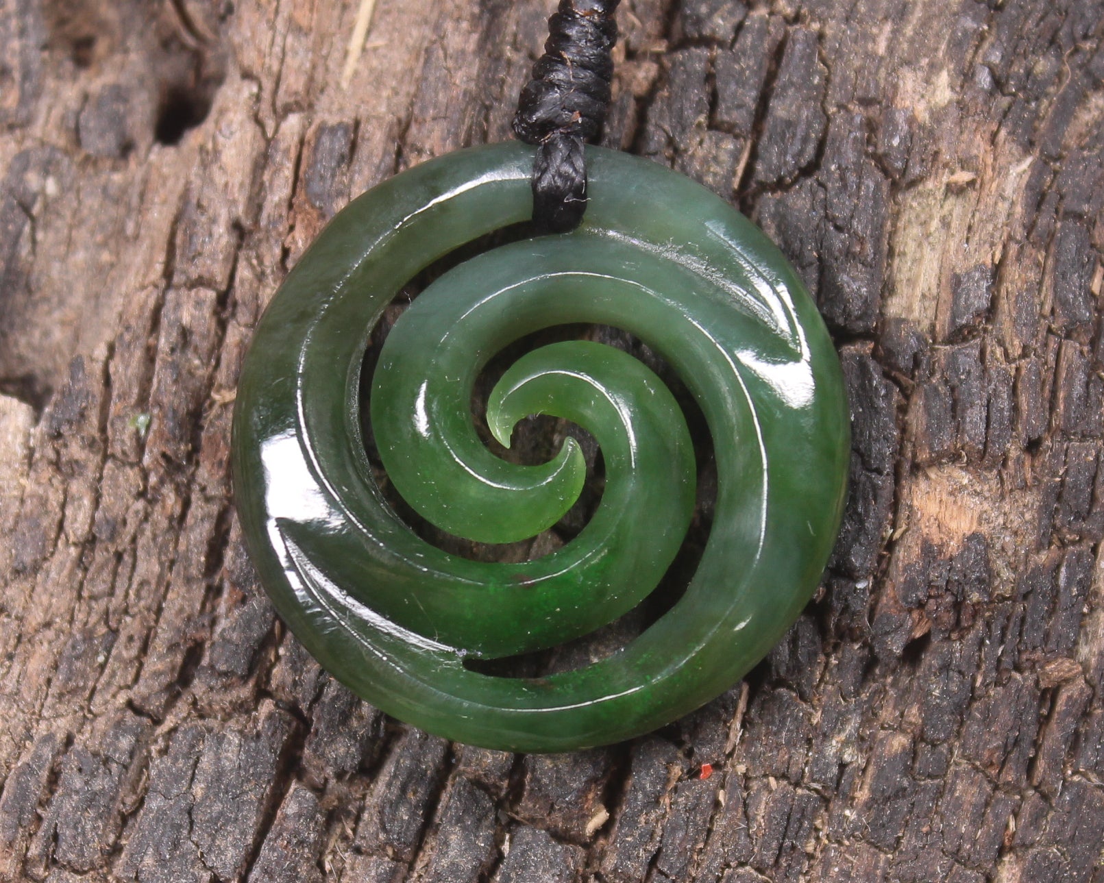 Koru pendant carved from Kawakawa Pounamu - NZ Greenstone