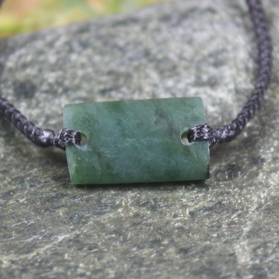 Adjustable cord bracelet with Rimu Pounamu