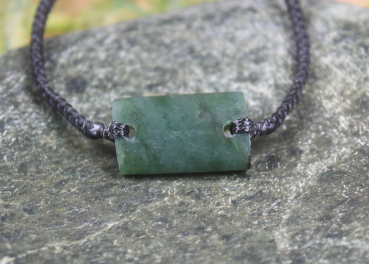 Adjustable cord bracelet with Rimu Pounamu