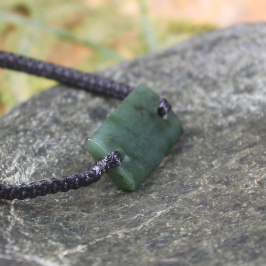 Adjustable cord bracelet with Rimu Pounamu