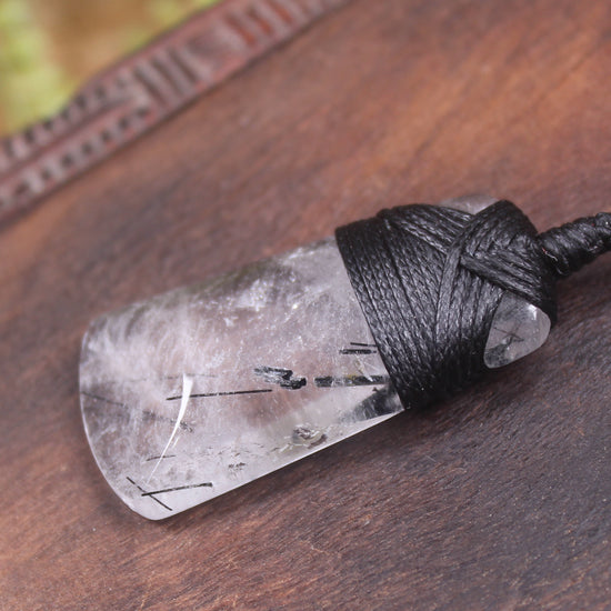 Quartz with Black Tourmaline carved into a Toki or Adze