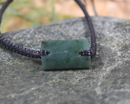 Adjustable cord bracelet with Rimu Pounamu