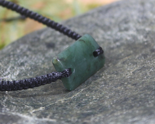 Adjustable cord bracelet with Rimu Pounamu