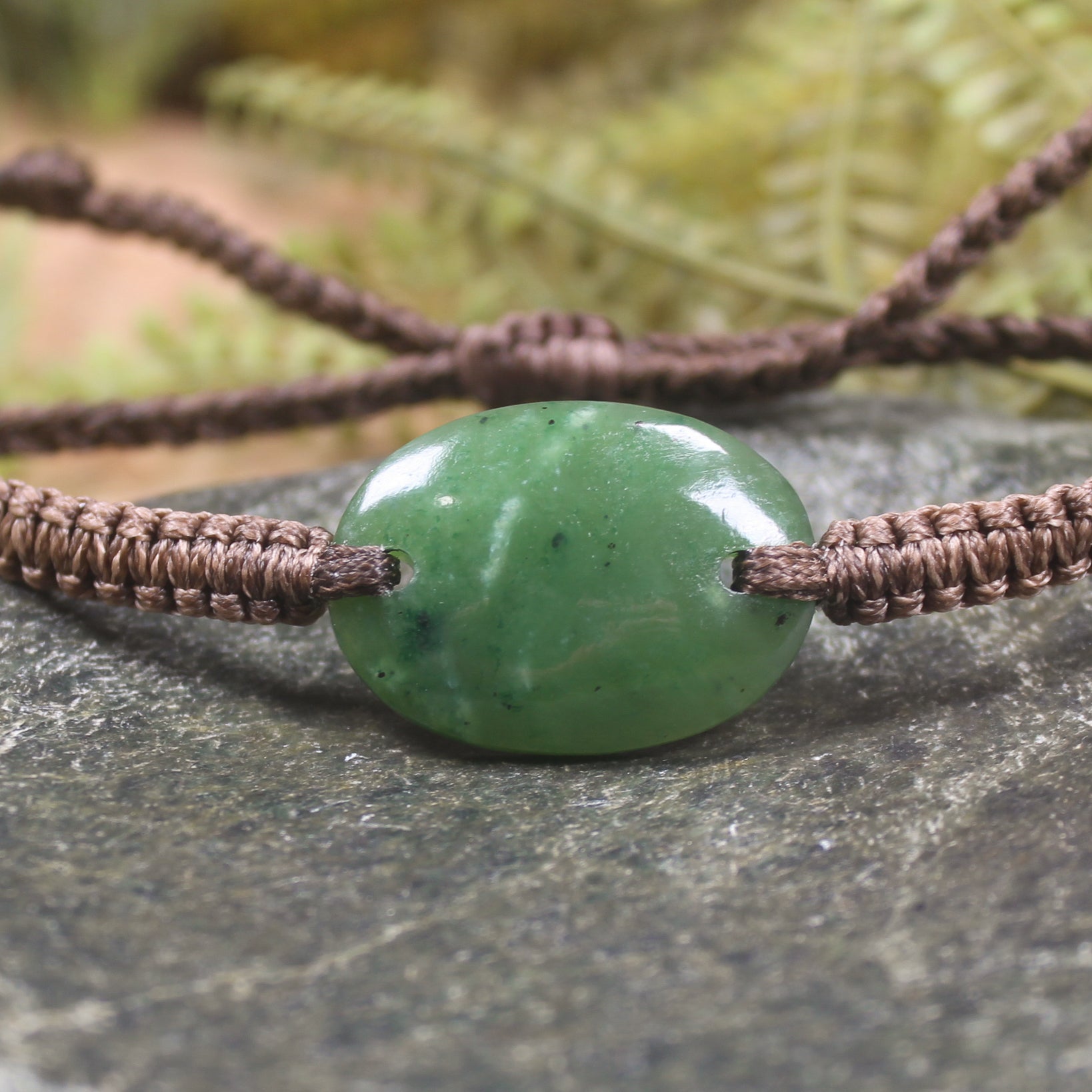 Adjustable cord bracelet with Kawakawa Pounamu