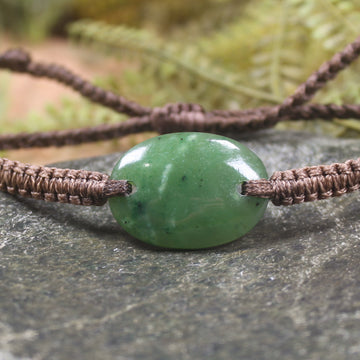 Adjustable cord bracelet with Kawakawa Pounamu