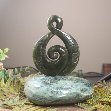 Rimu Pounamu Koru Twist set on a Pounamu base - NZ Greenstone