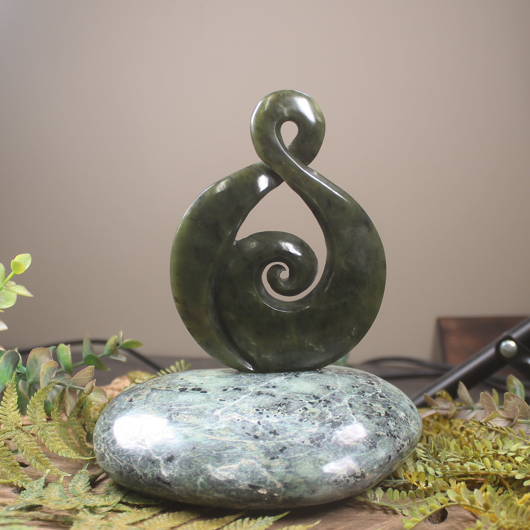 Rimu Pounamu Koru Twist set on a Pounamu base - NZ Greenstone