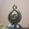 Rimu Pounamu Koru Twist set on a Pounamu base - NZ Greenstone