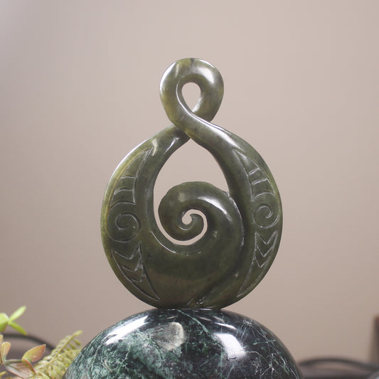 Rimu Pounamu Koru Twist set on a Pounamu base - NZ Greenstone