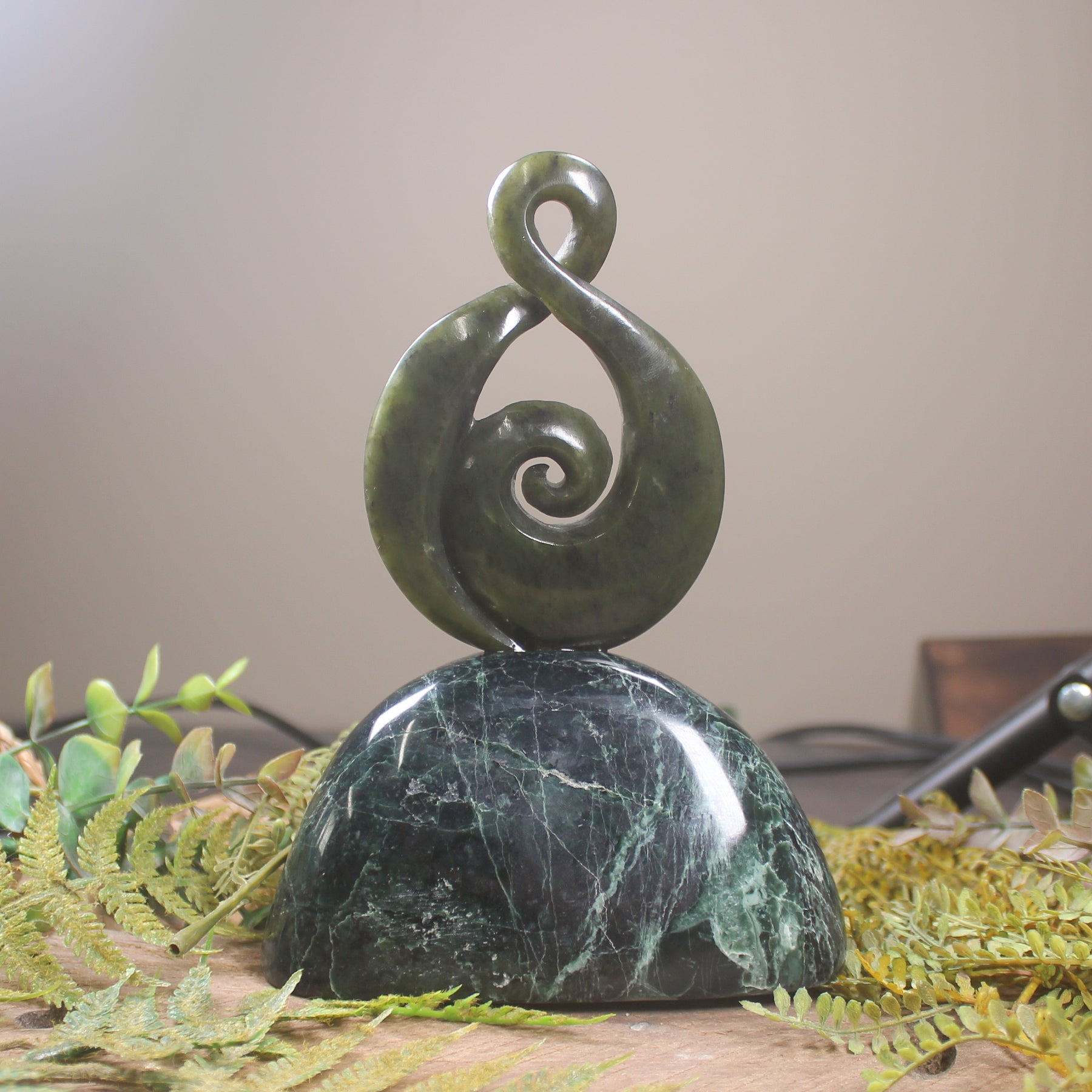 Rimu Pounamu Koru Twist set on a Pounamu base - NZ Greenstone