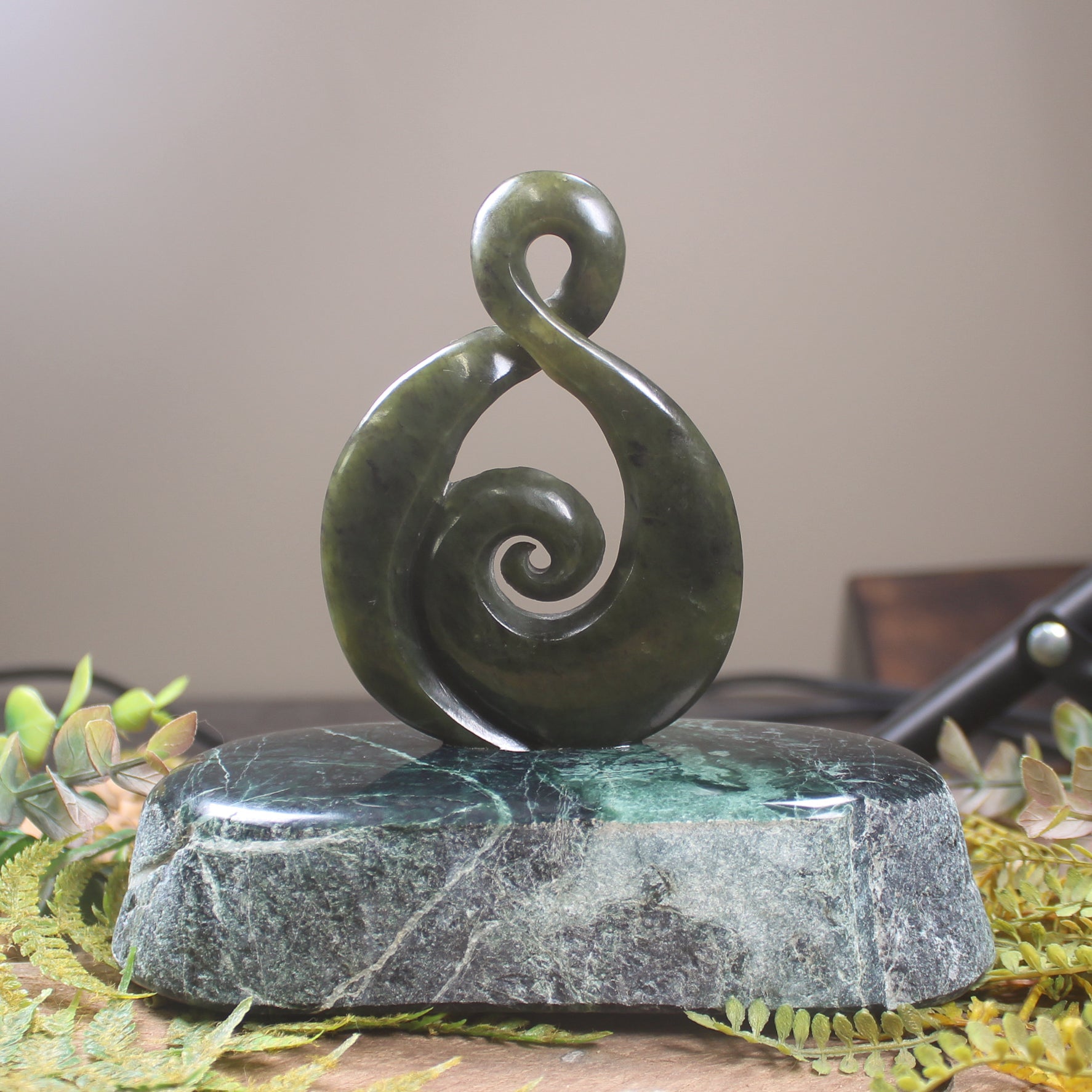 Rimu Pounamu Koru Twist set on a Pounamu base - NZ Greenstone