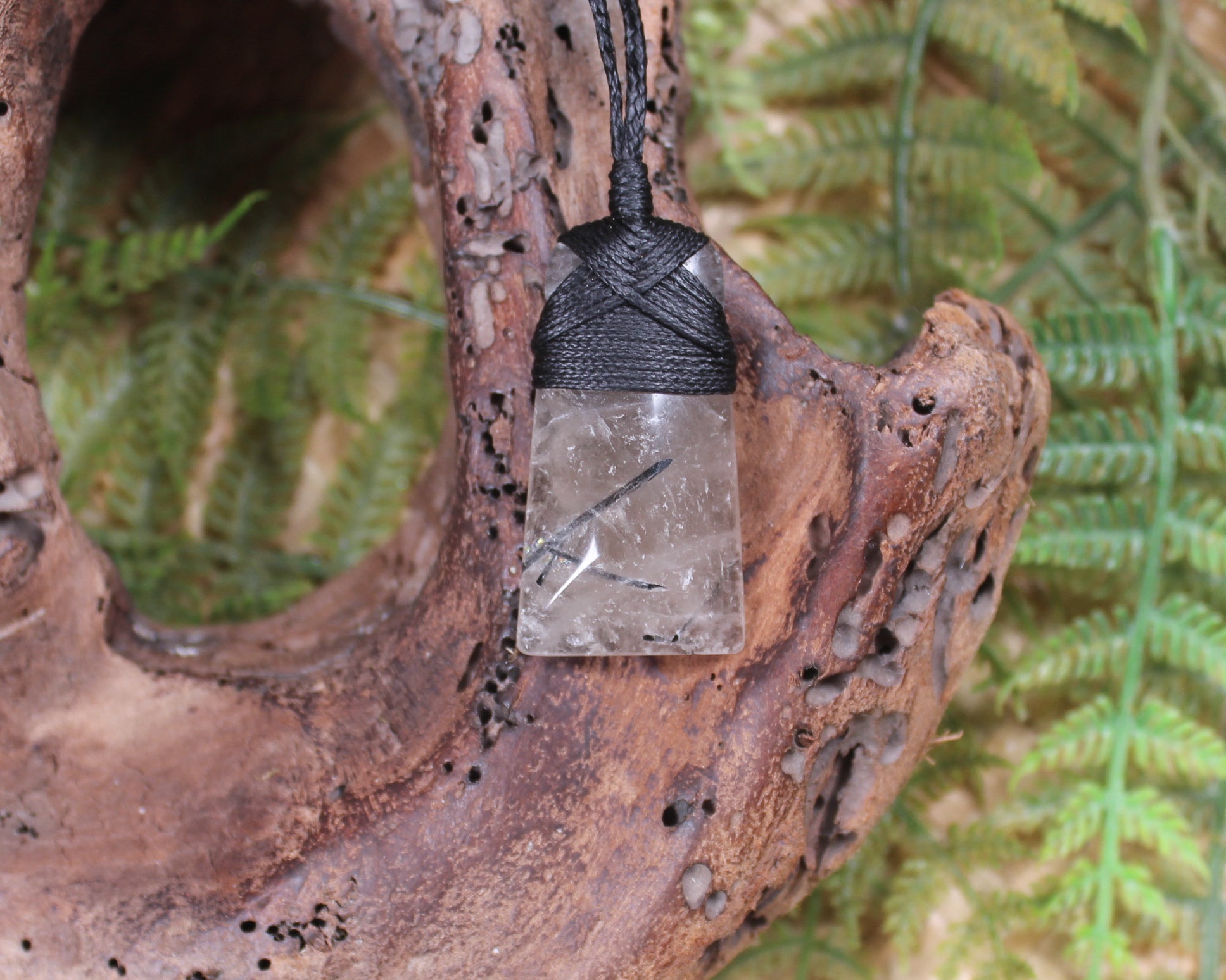 Clear Quartz with Black Tourmaline carved into a Toki or Adze