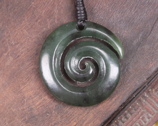 Koru pendant carved from Kawakawa Pounamu - NZ Greenstone